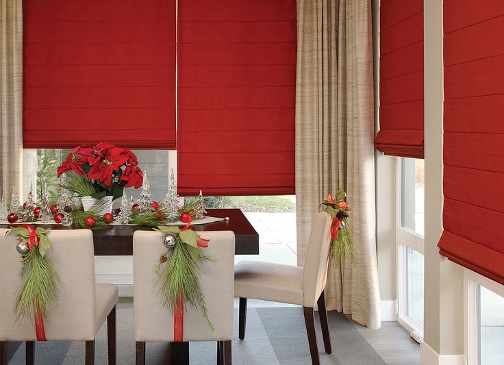 Hunter Douglas red Roman shades in dining room with holiday decor