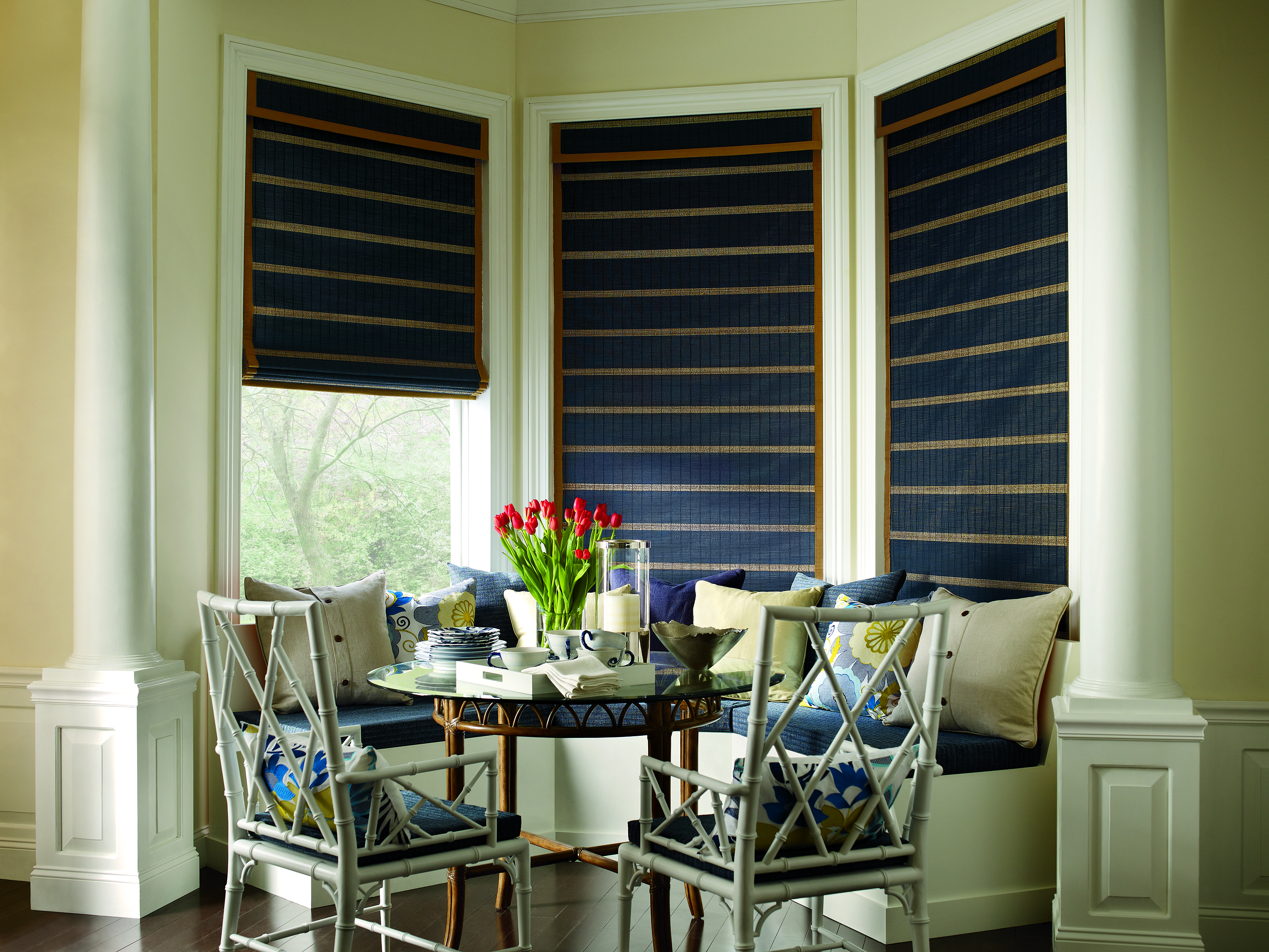 Hunter Douglas navy Woven Woods at dining room bay window seat