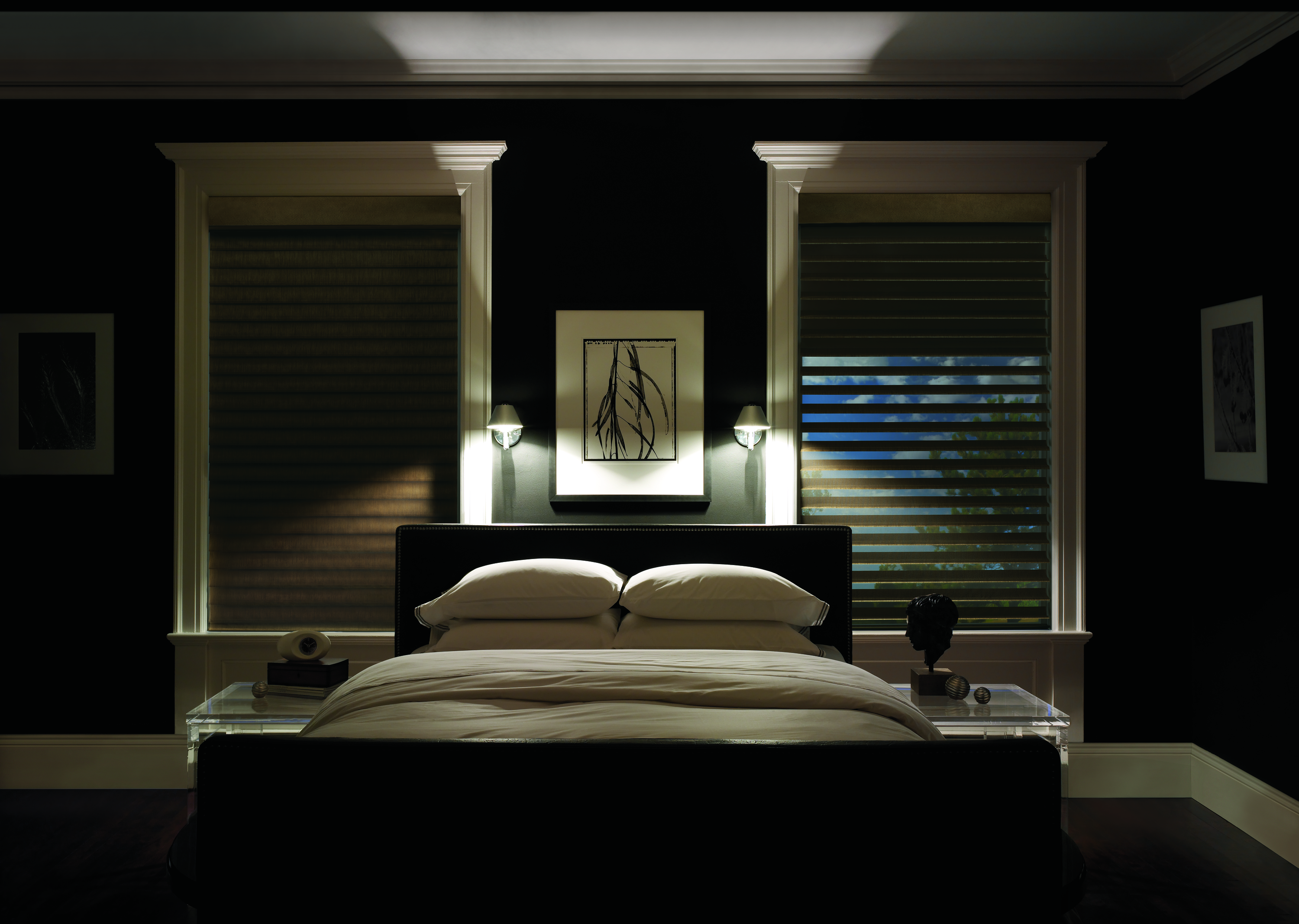 Dark master bedroom with Designer Banded Shades providing light control