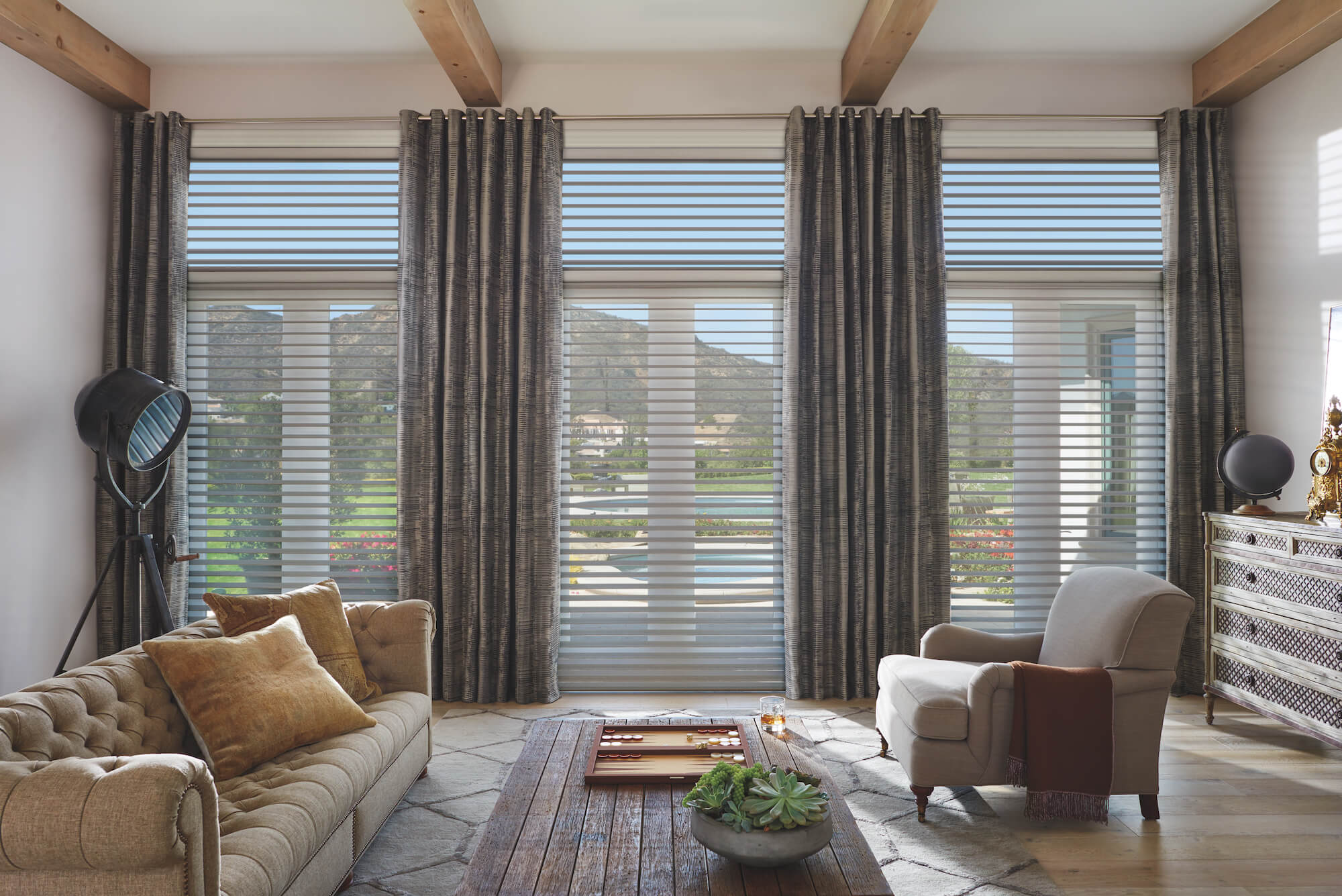 living room with floor to ceiling Hunter Douglas Silhouette Window Shadings
