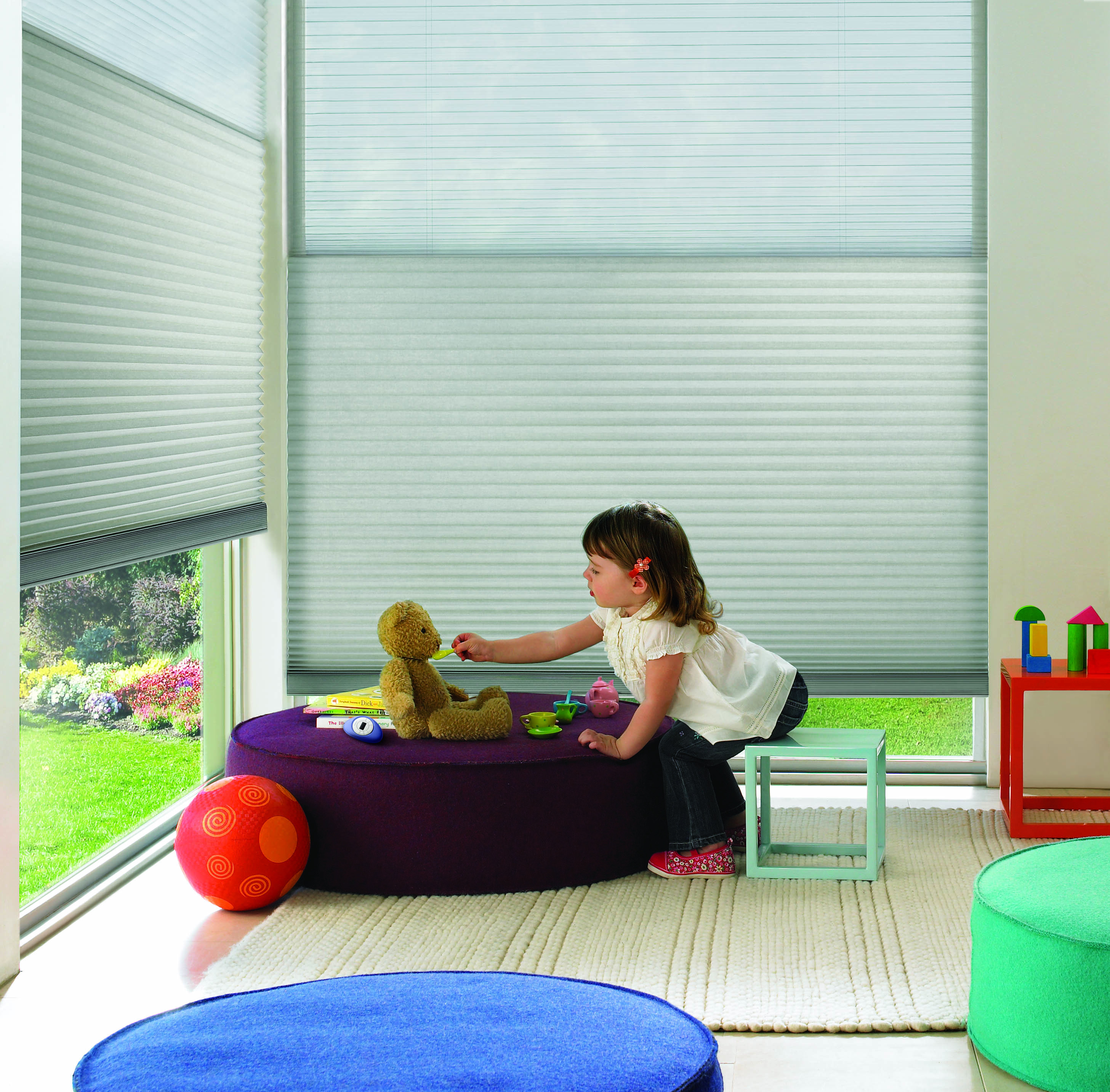 Hunter Douglas child safe motorized Duette Honeycomb shades in playroom