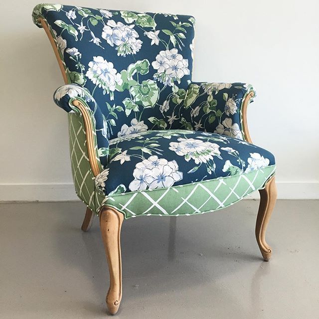 upholstered chair with navy floral front and green geometric back