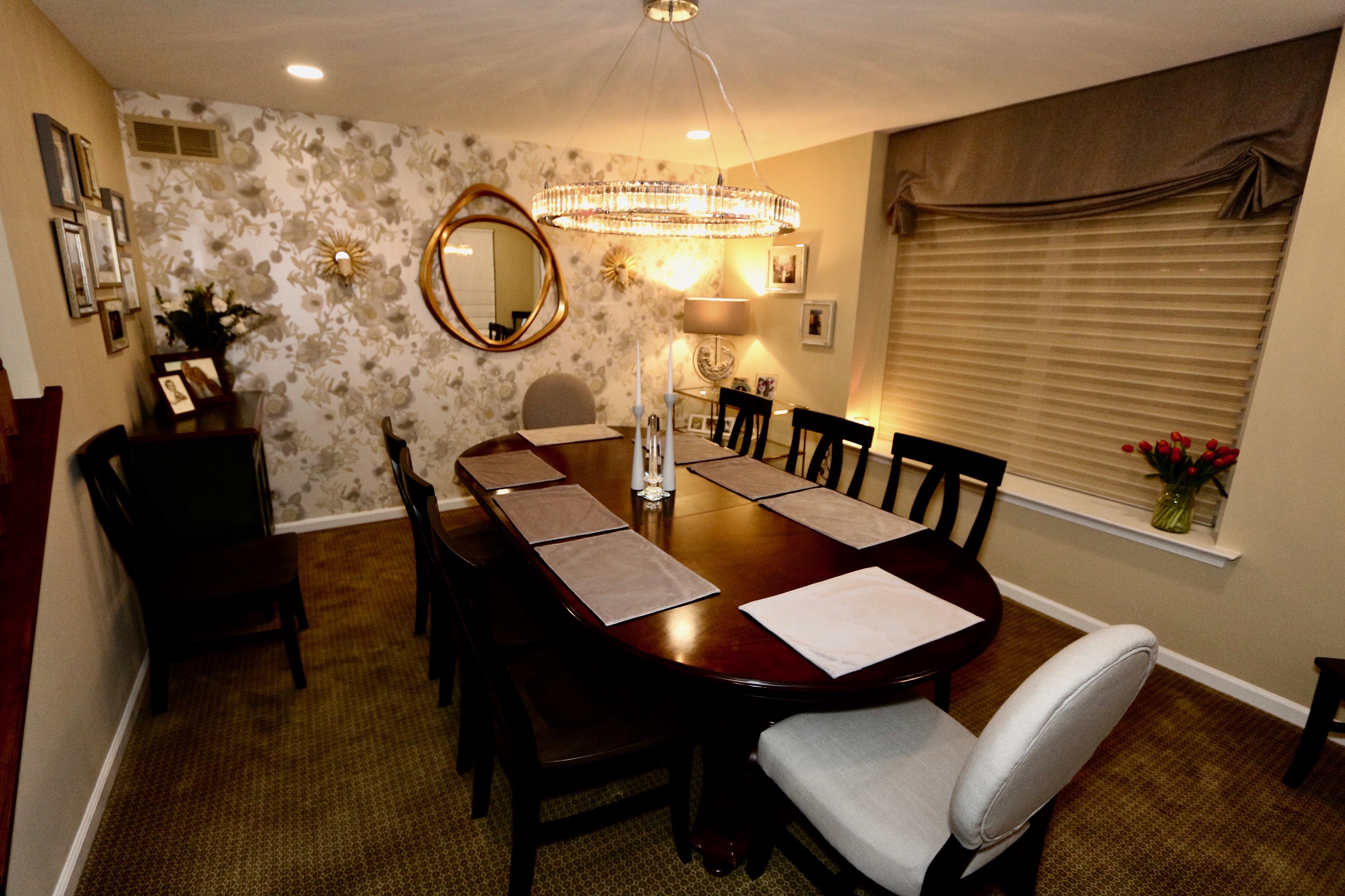 A dining room interior redesign with custom window treatments, drapery, and wallpaper