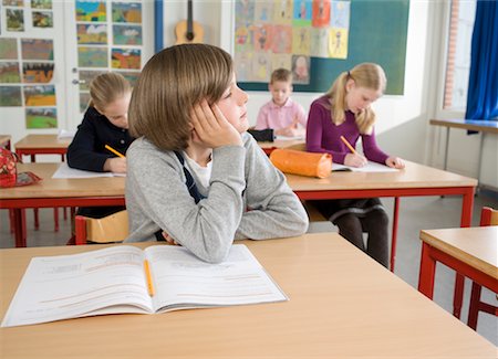 child distracted by window in classroom