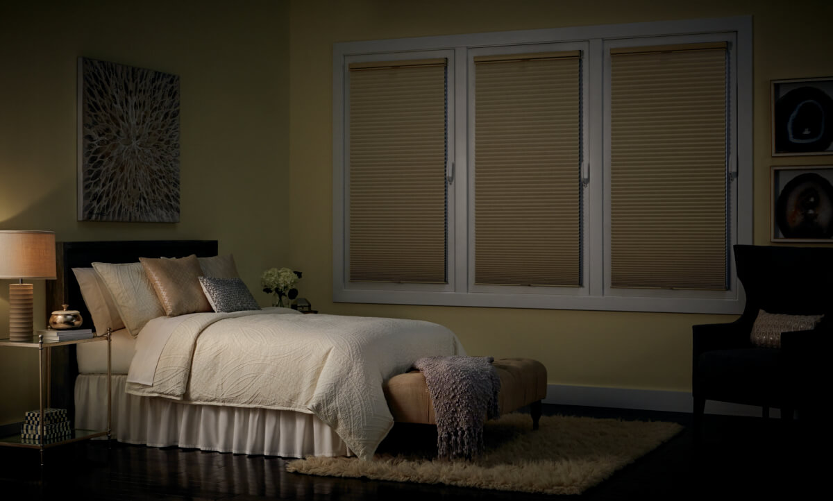 Hunter Douglas Duette Honeycomb shades with the LightLock system that provides ultimate darkness in bedroom.